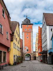 Historic Red Brick Tower Surrounded by Trees Under Cloudy Skies in Ochsenfurth, Germany