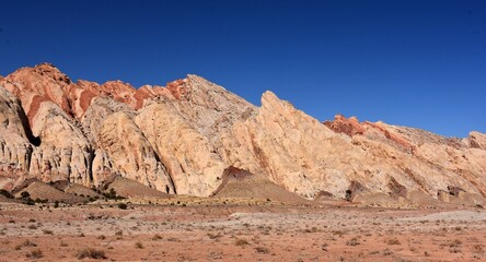 Fototapeta premium the colorful flatiron rock formations in the san rafael reef near uneva canyon on a sunny day, near green river, utah