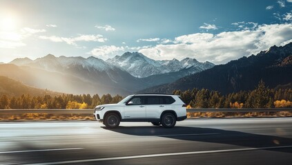 White SUV driving on highway, mountain landscape background.