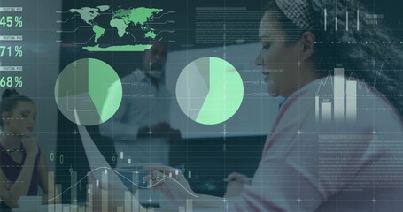 Image of financial data processing over diverse colleagues discussing work in office