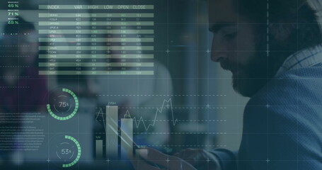 Image of financial data processing over biracial businessman using tablet in office