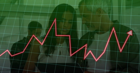 Financial graph image over diverse business people discussing in office