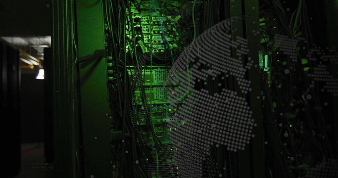 Binary code image over green-lit server racks in data center