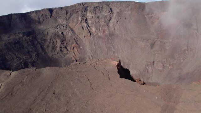 Aerial view by drone of the Piton de la Fournaise, the Dolomieu crater, the Formica L&eacute;o volcanic cone and the Chapelle de Rosemont in the Fouqu&eacute; enclosure, Reunion Island