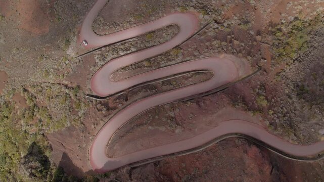 Aerial view by drone of the road that takes you to Piton de la Fournaise which crosses the Plaine des Sables, Reunion Island