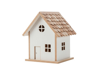 Small white wooden house model with a brown roof isolated on white background