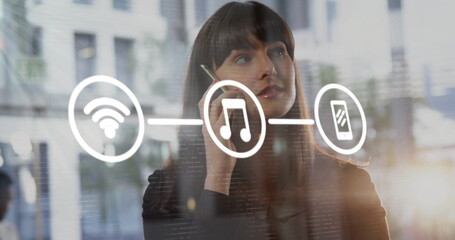 Image of network of connections with digital icons over caucasian businesswoman using smartphone