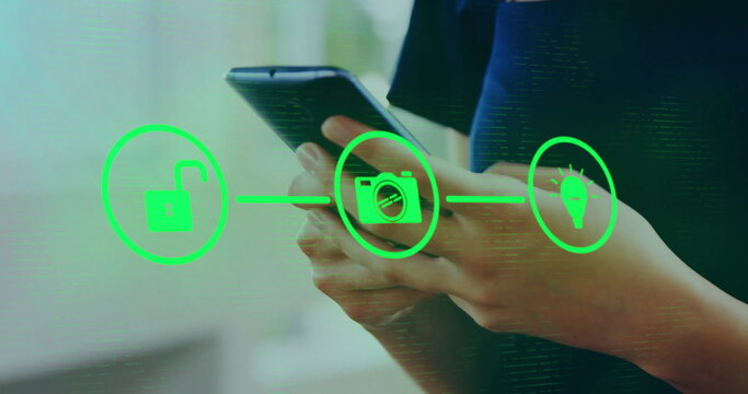 Image of network of connections with icons over biracial woman using smartphone