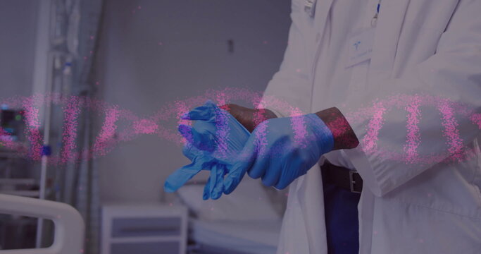 Image of dna strands over biracial female doctor with medical gloves