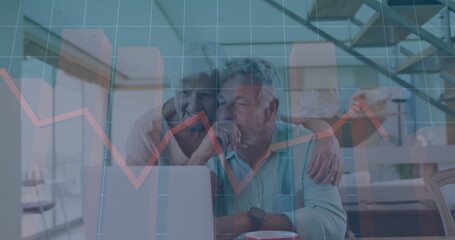 Financial graph image over senior couple using laptop in modern home