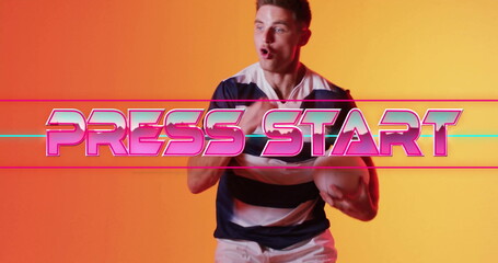 Press Start text image over man posing against orange background