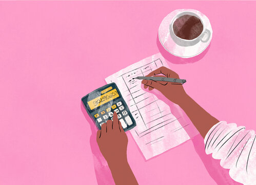Hands using a calculator and writing on documents with a cup of coffee on a pink background