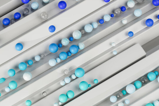 Different shades of blue colored marbles on metal structure
