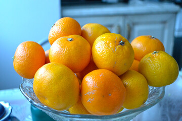 tangerines in a crystal vase