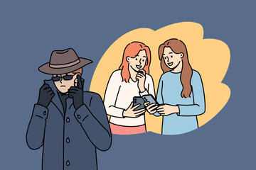 Man taps phone of women using malicious application downloaded from unverified source. Spy guy in long coat and hat taps phone with people talking, violating privacy of personal life