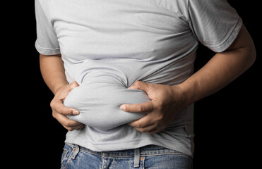 overweight or obese man shows fat deposits in the abdomen. healthcare, medicine concept.