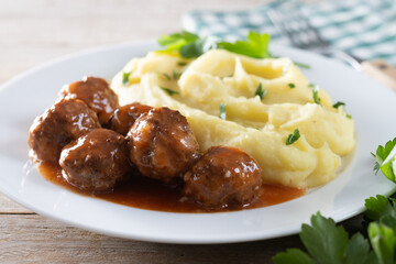 Meatballs with mashed potatoes  on wooden table