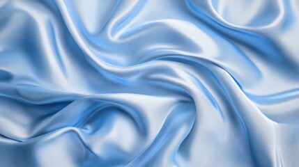 Fototapeta premium Light blue silk fabric drapes in flowing folds