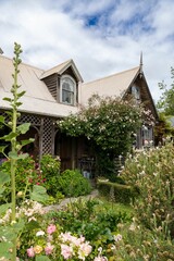 Charming rustic cottage with blooming garden
