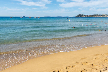 Morning view on crystal clear blue water of Plage du Debarquement white sandy beach near Cavalaire-sur-Mer and La Croix-Valmer, summer vacation on French Riviera, Var, France