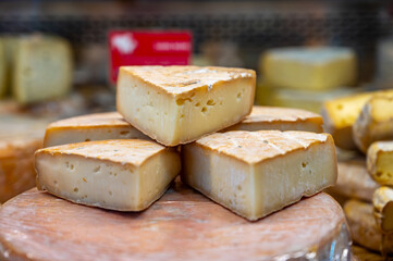 Farmer shop in Biarritz, France, Basque Country and Pyrenees sheep, cow and goat cheeses for sale, Tomme, Fermier Brebis, farmers cheese, close up