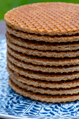 Traditional Dutch sweet dessert, Butter caramel syrup waffles, fresh baked