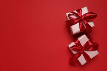 Beautiful gift boxes on color background