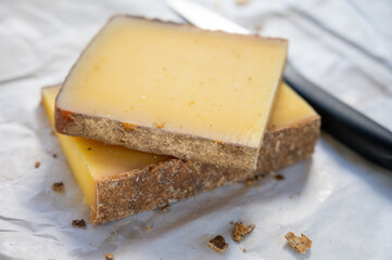 French cheese Comte, varieties unpasteurised ed milk Prestige, fruity flavoured Fruite and Vieille Reserve close up