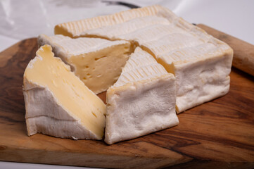 French squared pont l'eveque cow cheese from Calvados department, Normandy, France