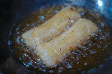 The rissoles are being fried in a frying pan, the croquettes are being fried, good for recipes or commercial