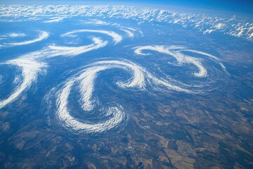 Aerial View of Swirling Cloud Formations over Rural Landscape