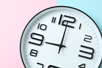 Big beautiful stylish clock on color background