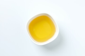 Bowl of fresh oil on white background