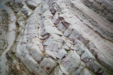 Pattern textured of Coastal erosion is caused by the forces of tides, wind and time, which affect...
