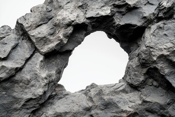 A natural rock formation with a hole, isolated on white.