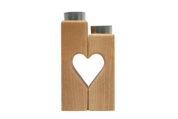 Wooden candle holder. Front view. The support consists of two pieces of wood and in the middle forms a heart. Isolated on a white background.