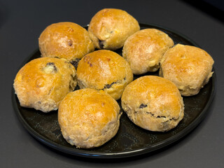 Healthy buns made from cottage cheese and spelled flour, baked in an electric oven and lightly brushed with butter.  The buns are filled with ground poppy seeds.