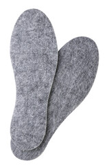 Pair of felt shoe insoles close-up on a white background. Top view