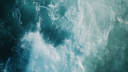Fototapeta premium Massive blue ocean wave with white foam showcasing natural power and energy, potentially inviting surfers to embrace the thrill of riding