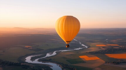 Obraz premium hero image hot air balloon floating above picturesque valley with vibrant fields and winding rivers below