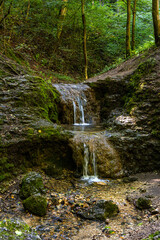 Bolechowka creek double cascades in Dolina Bolechowicka Valley within Cracow Valleys landscape park of Cracow-Czestochowa Jurassic natural reserve in Lesser Poland
