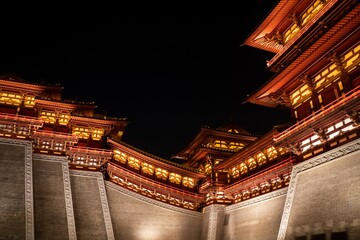 Illuminated traditional Asian architecture at night