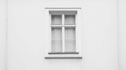 Single white window on a white wall.