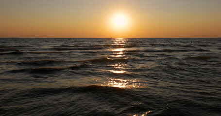 Landscape or seascape, nature, sunset on sea, wave and beach. Summer wallpaper. Concept vacation and travel.