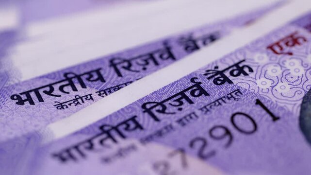 Close shot of Indian one hundred rupee notes. registering  name of Reserve Bank of India.