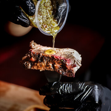 Melted Butter Sauce on Medium Rare Steak
Melted herb butter poured over medium rare steak creating rich flavor and texture, perfect for steakhouse menu and gourmet food advertising.
