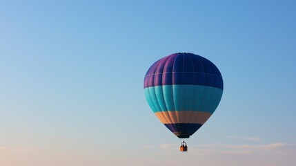 Naklejka premium Colorful Hot Air Balloon Ascending in Clear Blue Sky