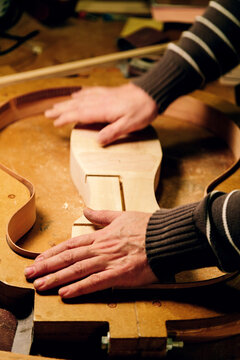 Crafting precision: artisan shaping bass guitar components