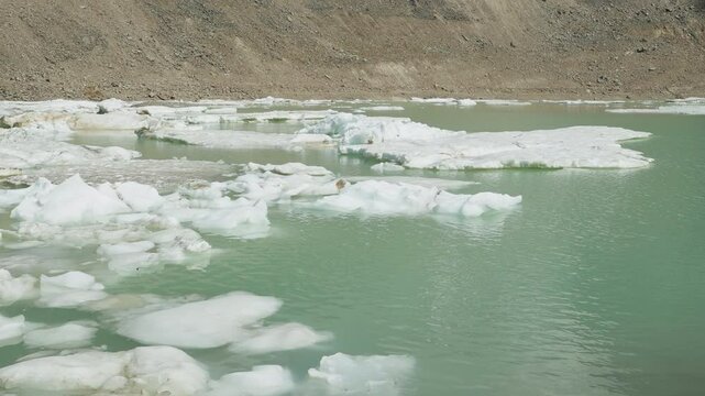A serene glacial lake with melting icebergs in Mount Edith Cavell, Canadian Rockies