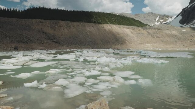 A serene glacier-fed lake surrounded by Mount Edith Cavell in Canadian Rockies